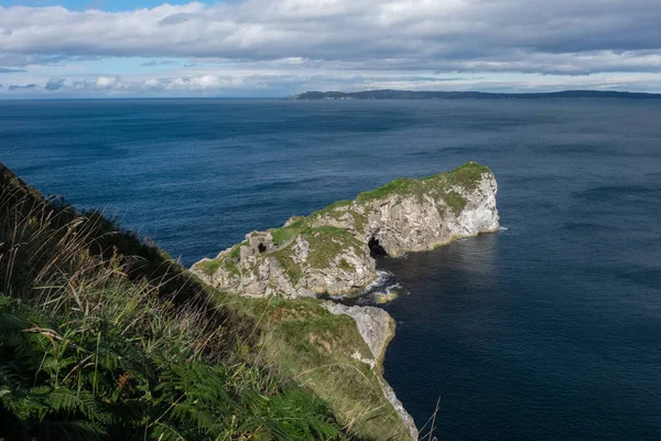 Landscape of Kinbane Castle from distance, Northern Ireland, United Kingdom