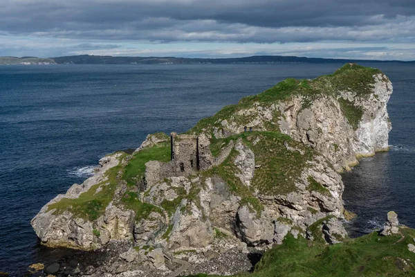 Landscape of Kinbane Castle from distance, Northern Ireland, United Kingdom