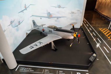F-51D Mustang fighter of the Korean Air Force on static display at the War Memorial of Korea, Seoul, set on a mock runway for aviation history education.