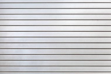 Gri renk yakın çekim, metal geçit doku, yatay demir roller kepenkler.