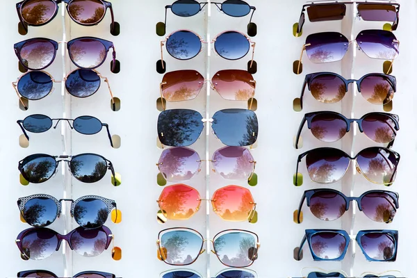 Showcase with sunglasses of different designs and different colors.