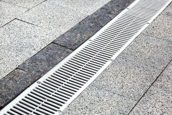 Metal Gutter Pedestrian Sidewalk Decorative Stone Tiles Close — Stock Photo, Image