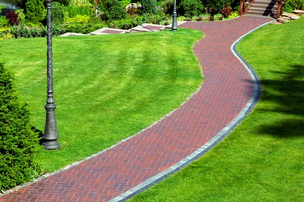 Curved Pedestrian Pavement Backyard Red Tile Drainage System Green Grass Stock Photo