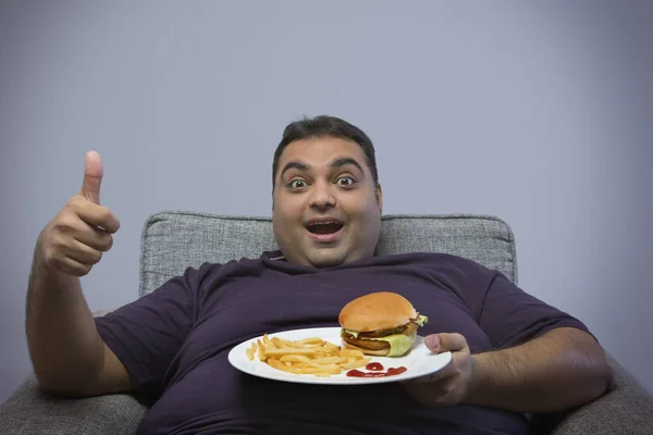 Smiling Obese Man Sitting Chair Holding Plate Burger French Fries — Stock Photo, Image