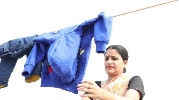 Lower Middle Class Woman Checking Taking Dry Clothes Wire — Stock Video