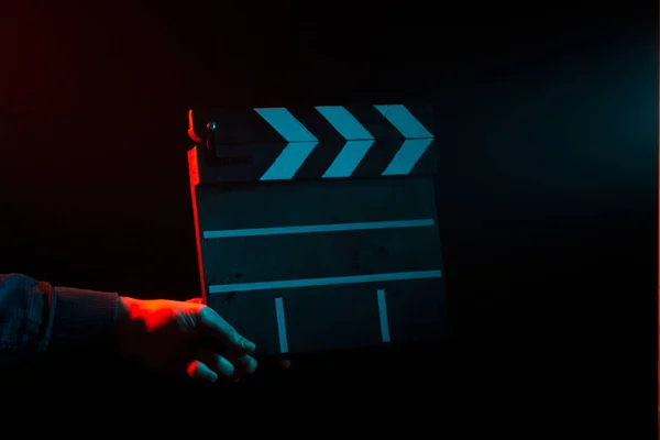 Closed Clapperboard Cinema Hand Filming Black Isolated Background Red Blue — Stock Photo, Image