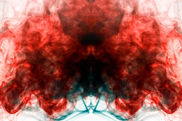 A multi-colored pattern of green and red smoke of a mystical shape in the form of a face and a ghost\'s head or a strange creature on a white isolated background. Abstract pattern in of waves and steam