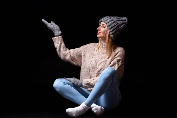 Smiling Blonde Girl Gray Knitted Gloves Hat Sweater Sitting Black — Stock Photo, Image