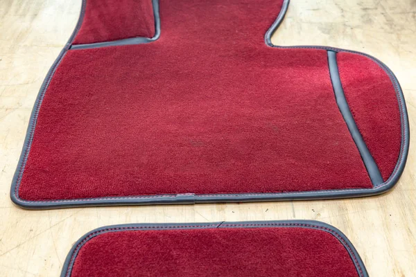 Car 3D handmade floor mats of red color from wool for front and — Stock Photo, Image