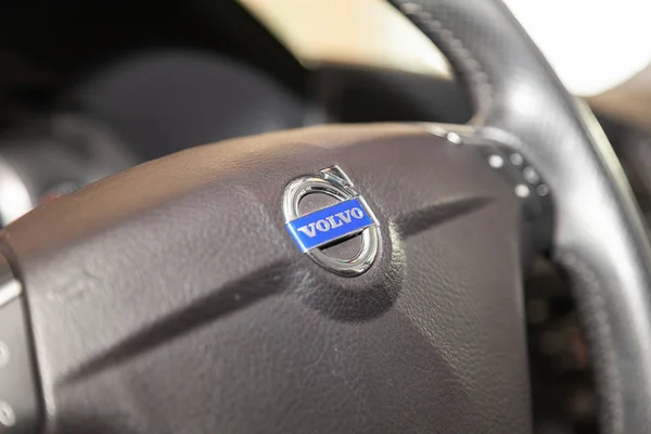 Interior view with steering wheel, emblem and buttons of black V — Stock Photo, Image