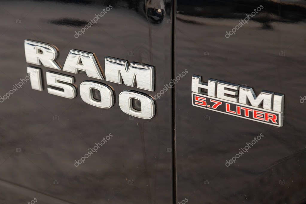 Novosibirsk, Russia - 12.01.2018: Black Dodge Ram with an engine of 5.7 liters front fender view with emblem 1500 Hemi on the car parking with snow background.