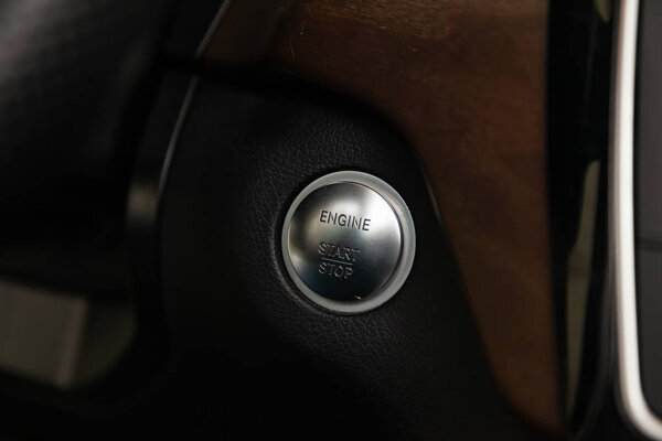 Interior view with start-stop engine button of luxury very expen