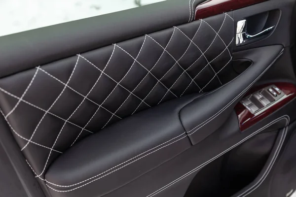 Interior of a luxury car with leather interior overtightened sti