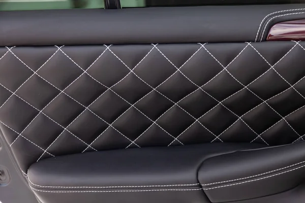 Interior of a luxury car with leather interior overtightened sti