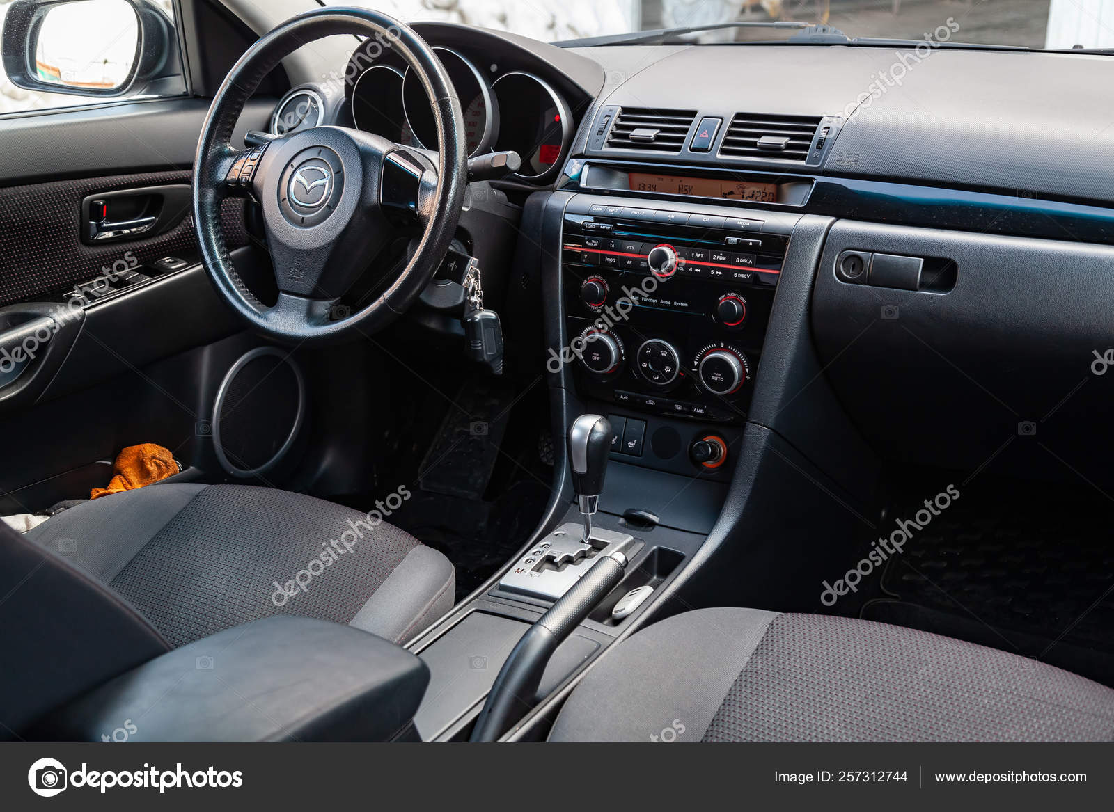 The Interior Of The Car Mazda 3 With A View Of The Steering
