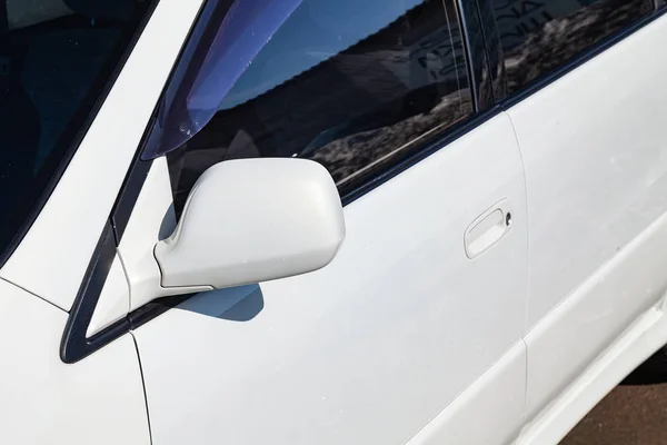 Front side mirror view of car in white color after cleaning befo — Stock Photo, Image