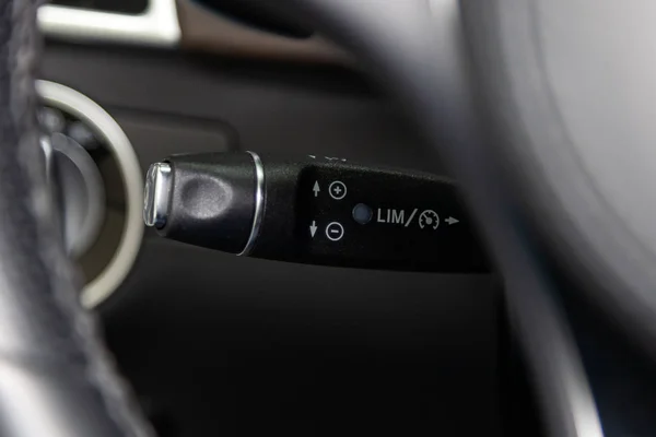 The shift lever to set the automatic cruise control speed inside
