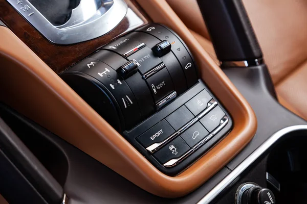 Close-up on the suspension control buttons for different road co — Stock Photo, Image