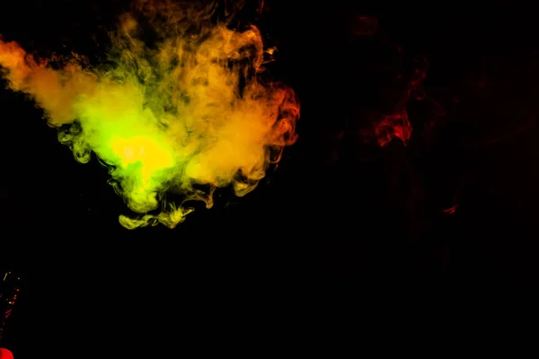 Beautiful horizontal column of smoke in the neon bright light of