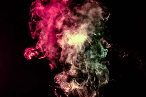 Beautiful column of smoke in the neon bright light of red, green