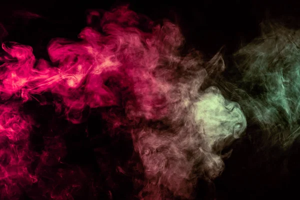 Beautiful column of smoke in the neon bright light of red, green — Stock Photo, Image