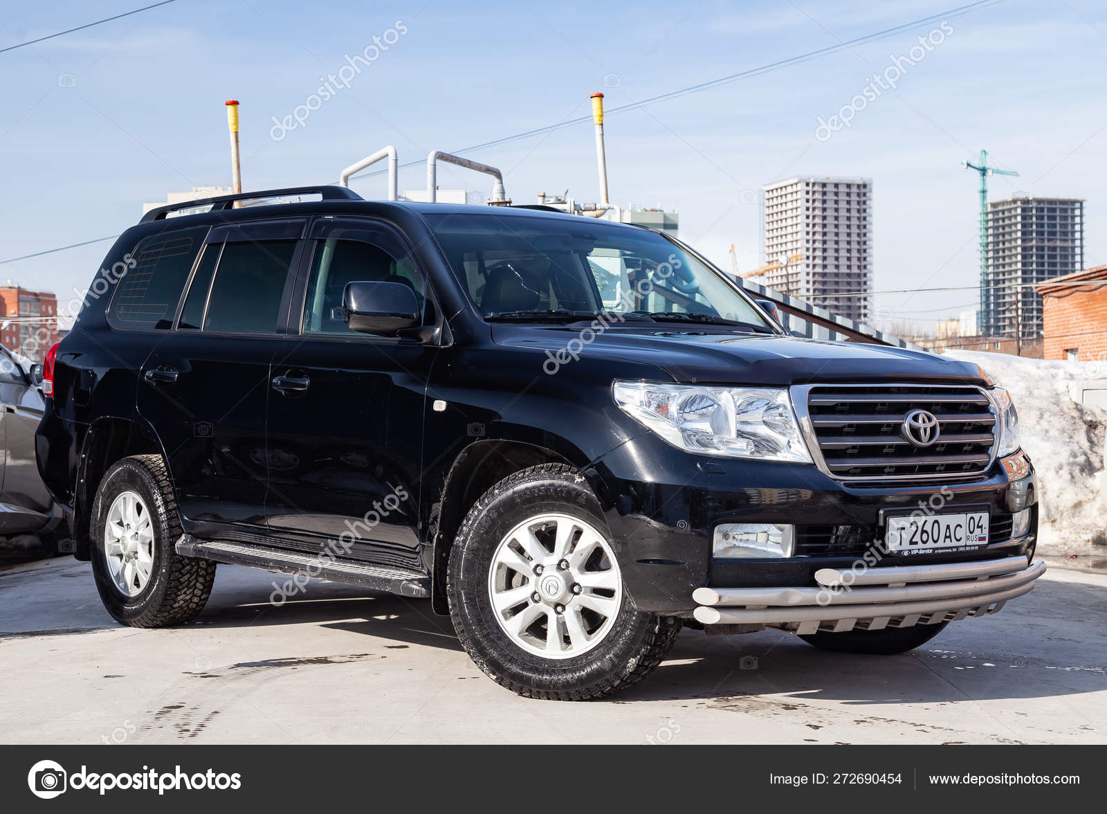 Front view of Toyota Land Cruiser 200 in black color after clean