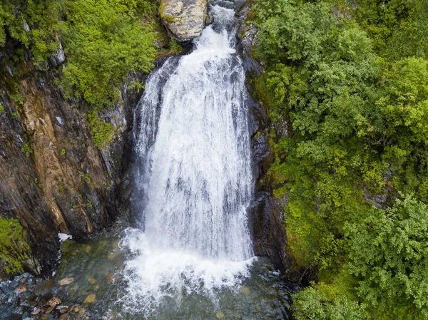 A large waterfall in the back of the Altai Mountains with gray-b Royalty Free Stock Photos