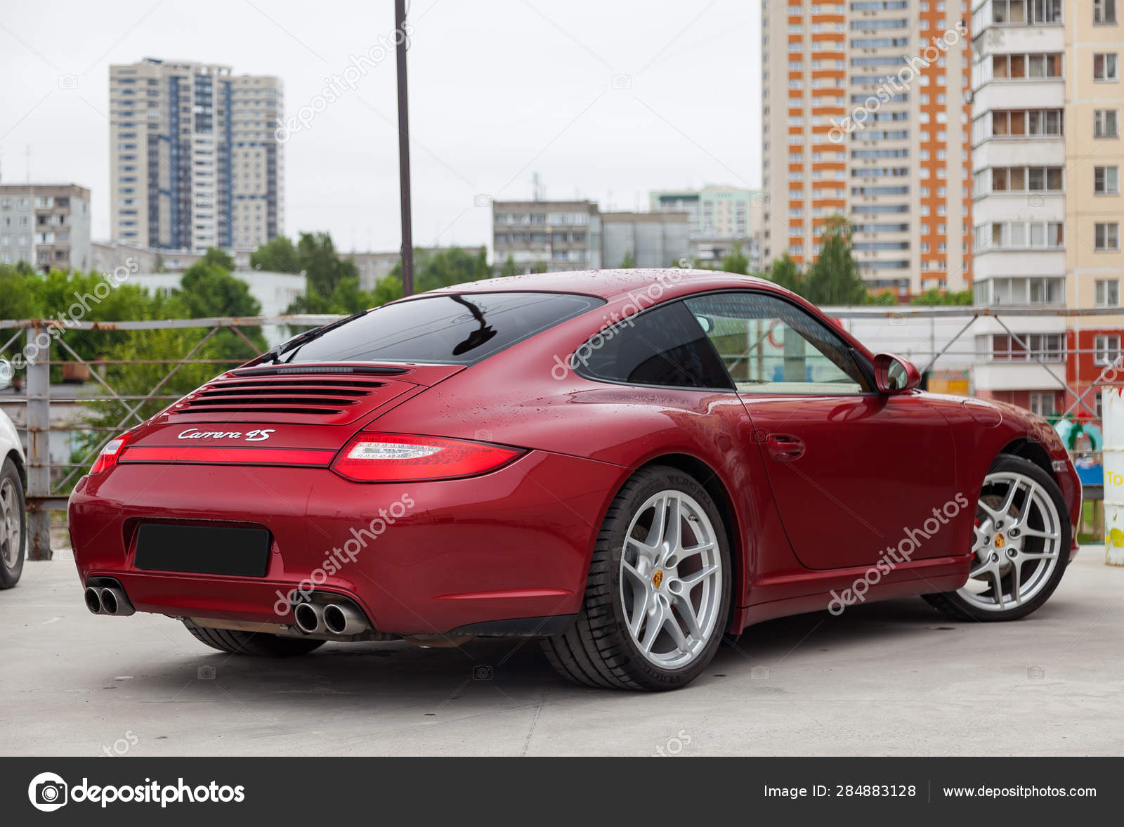 Rear View Of Car Porsche 911 Carrera 4s With Dark Gray