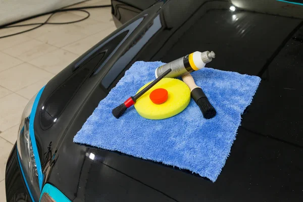 A set of tools for polishing and washing a car consisting of blu