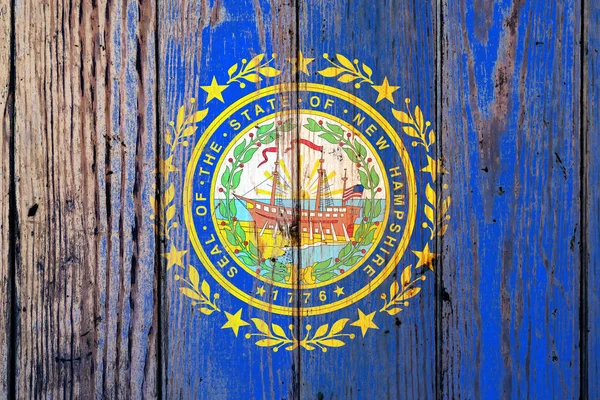 New Hampshire US state national flag on a gray wooden boards bac — Stock Photo, Image