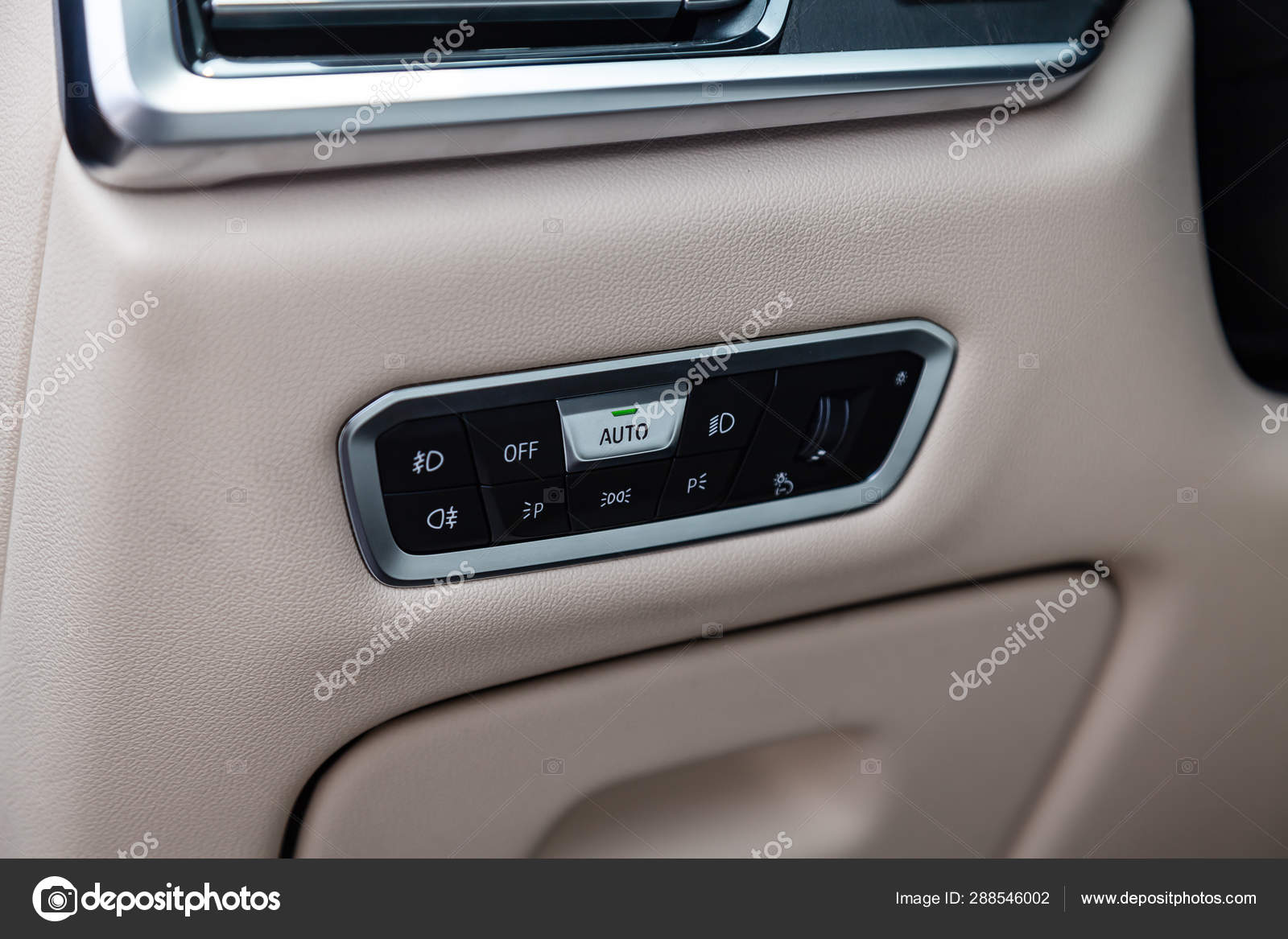 View To The White And Brown Interior Of Car With Dashboard