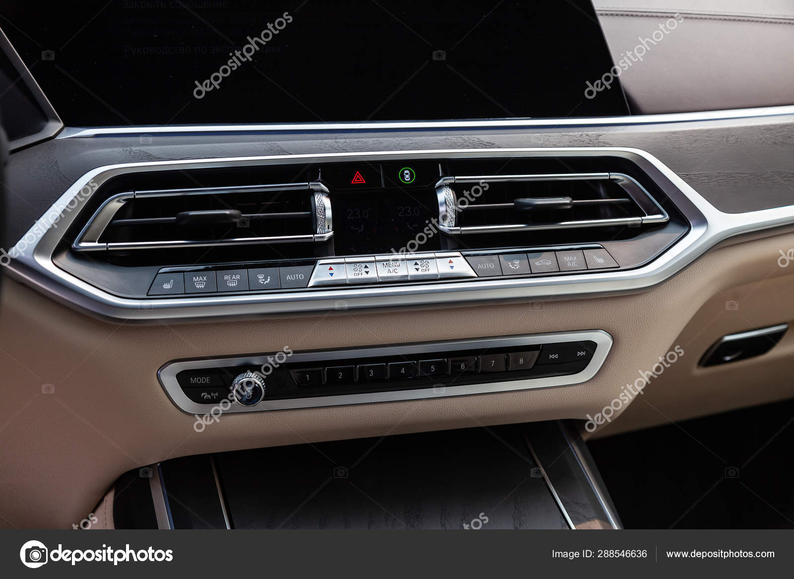 View To The White And Brown Interior Of Car With Dashboard