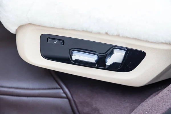 View to the white and brown interior of car with seat control bu — Stock Photo, Image