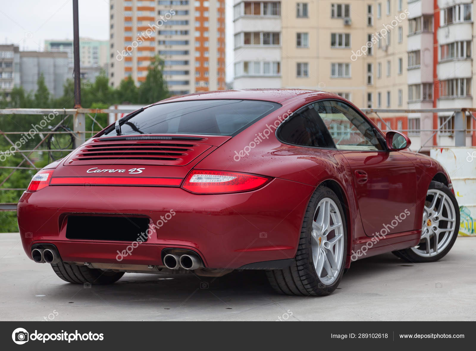 Rear View Of Car Porsche 911 Carrera 4s With Dark Gray