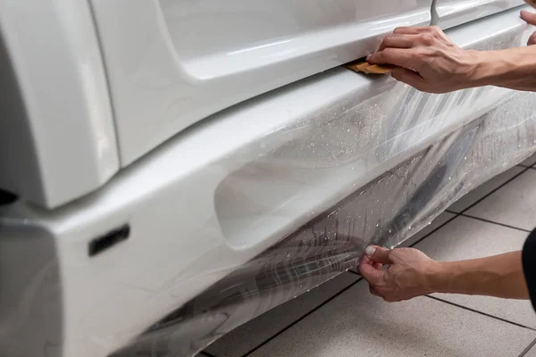 Retrofitting the car with a solid transparent protective film, t — Stock Photo, Image