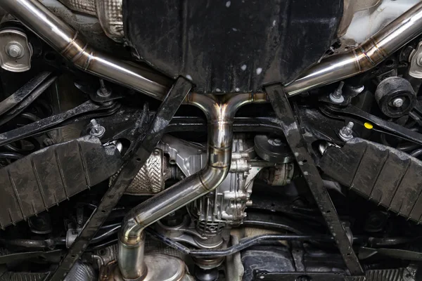 Fabrication and installation of a stainless steel car exhaust pi — Stock Photo, Image