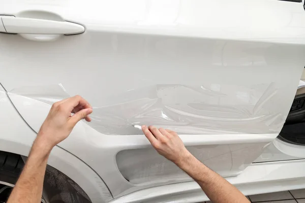 Retrofitting the car with a solid transparent protective film, t — Stock Photo, Image