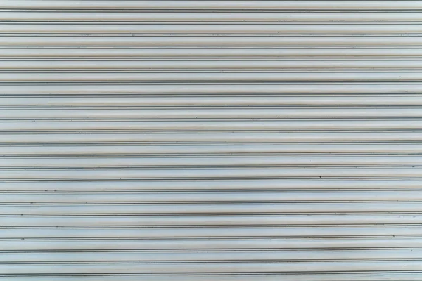 Texture of white Steel roll door horizontal line.