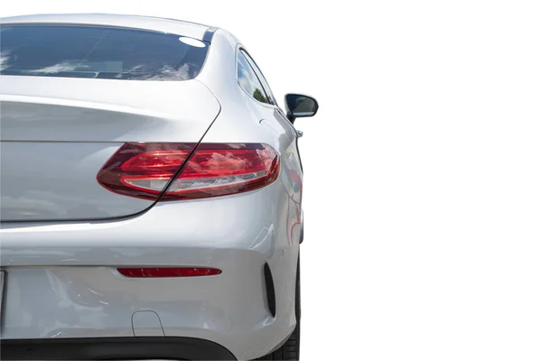 clipping path. Focus of Luxury car Tail light and Rear bumper. Isolated on white background.