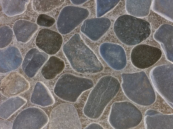 Pared Decorativa Pavimentada Con Piedras Redondas Planas Mar Casi Completamente —  Fotos de Stock