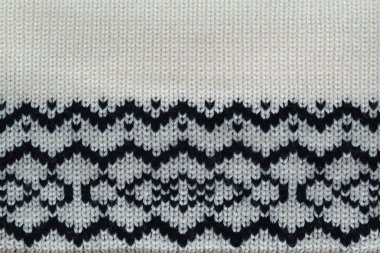 Yün siyah ve beyaz konuları ile stilize desen örme, kavram sıcak giysiler, yakın