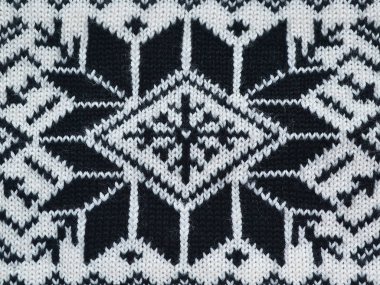 Yün siyah ve beyaz konuları ile stilize desen örme, kavram sıcak giysiler, yakın