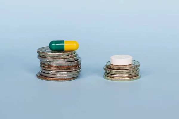 Medicine Capsule Stack Coins Blue Background Close Concept High Cost — Stock Photo, Image