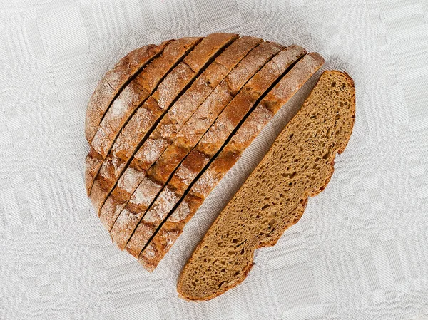 Sliced Loaf Rye Bread Appetizing Crispy Brown Crust Gray Linen — Stock Photo, Image