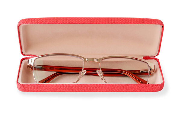 Glasses for sight with a golden rim in a pink glasses case.