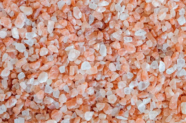 Textura de cristales rosados de sal himalaya. Fondo mineral natural — Foto de Stock