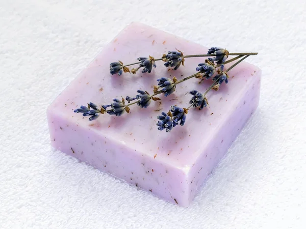 Handmade soap bar with dry aromatic lavender flowers.