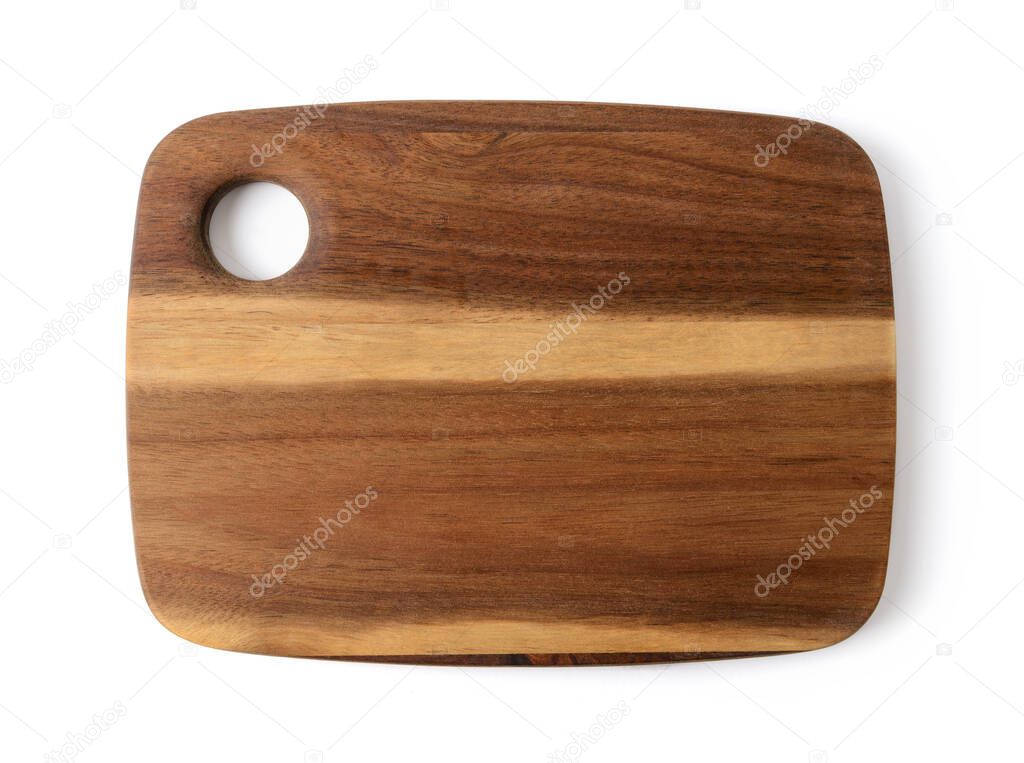 New cutting or serving board of acacia wood isolated on white background. New rectangular chopping board. Modern kitchen utensils made from natural materials. Top view.
