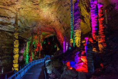 Colorful stalactite and stalagmite in the Huanglong Cave in Zhangjiajie clipart