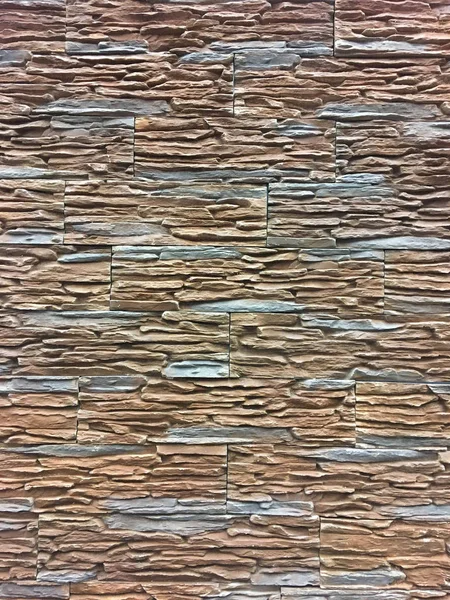 Piedra artificial. Pared decorativa de piedra artificial rasgada. fondo o textura . — Foto de Stock